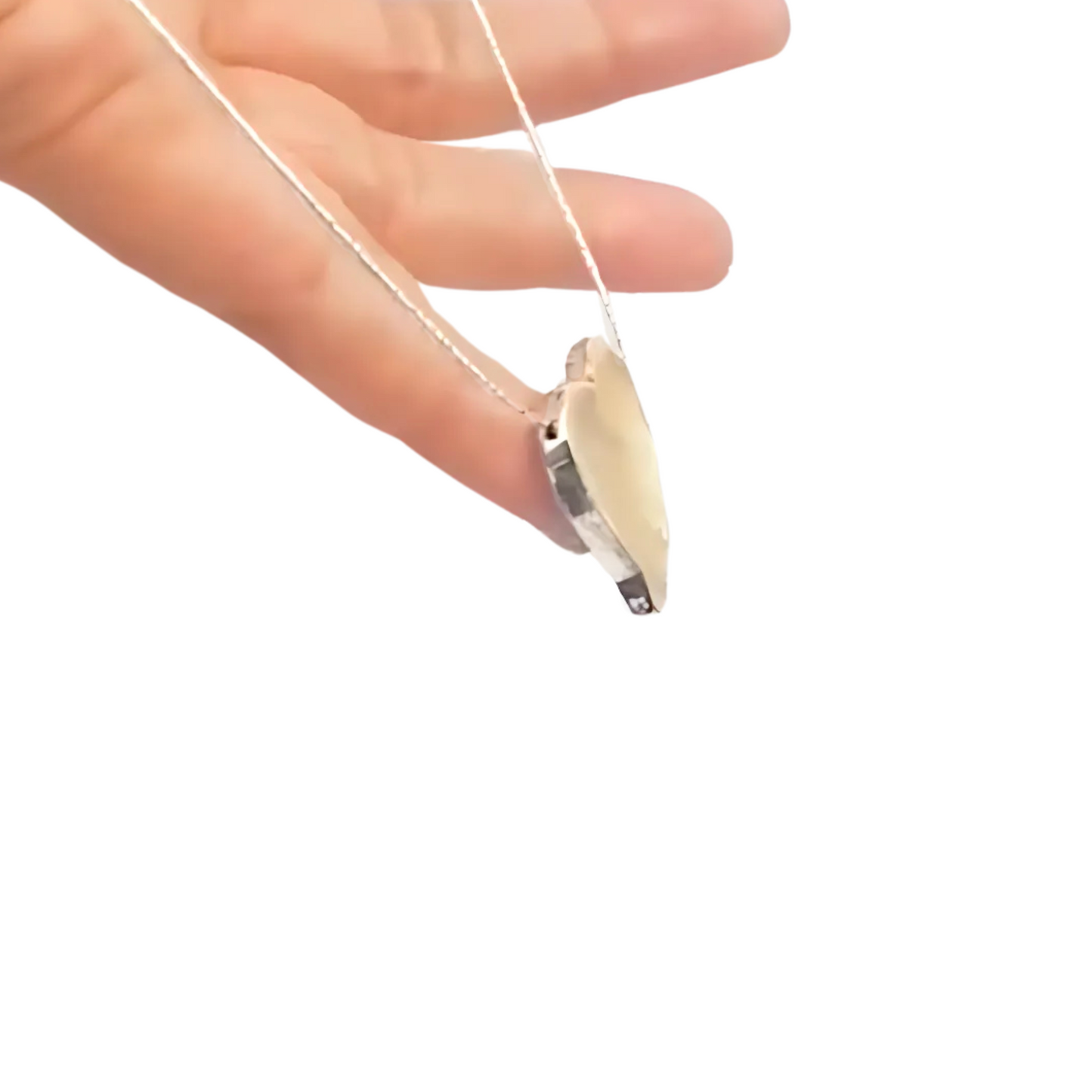 Elegant heart pendant in 9k yellow gold with a polished finish, hanging from a delicate silver chain. This charming pendant is a perfect gift for her, ideal for Christmas, Valentineās Day, or any special occasion, expressing love and sophistication