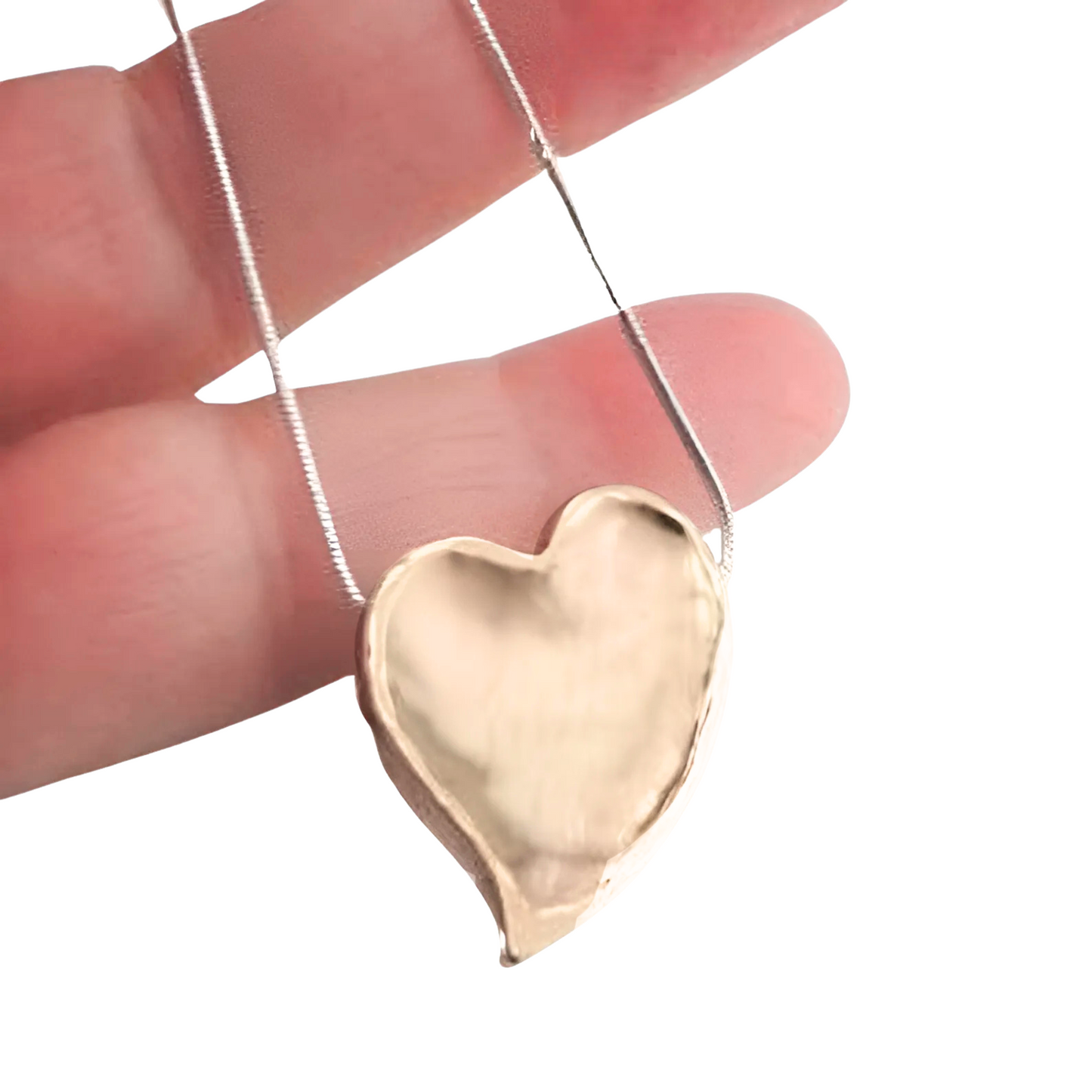 Elegant heart pendant in 9k yellow gold with a polished finish, hanging from a delicate silver chain. This charming pendant is a perfect gift for her, ideal for Christmas, Valentineās Day, or any special occasion, expressing love and sophistication