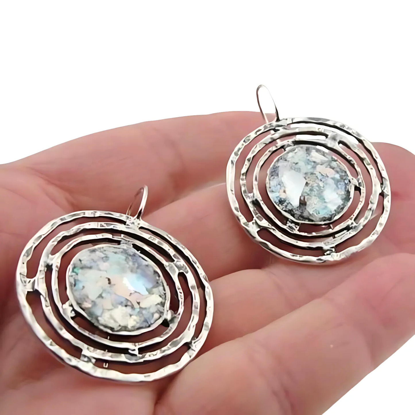 Handmade sterling silver earrings featuring ancient Roman glass with a unique, spiral-inspired design. These one-of-a-kind earrings showcase 2000-year-old glass, adding historical charm and sophistication to any look