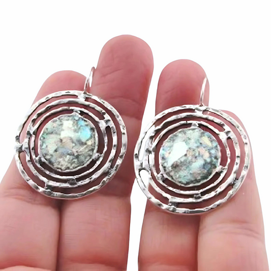 Handmade sterling silver earrings featuring ancient Roman glass with a unique, spiral-inspired design. These one-of-a-kind earrings showcase 2000-year-old glass, adding historical charm and sophistication to any look