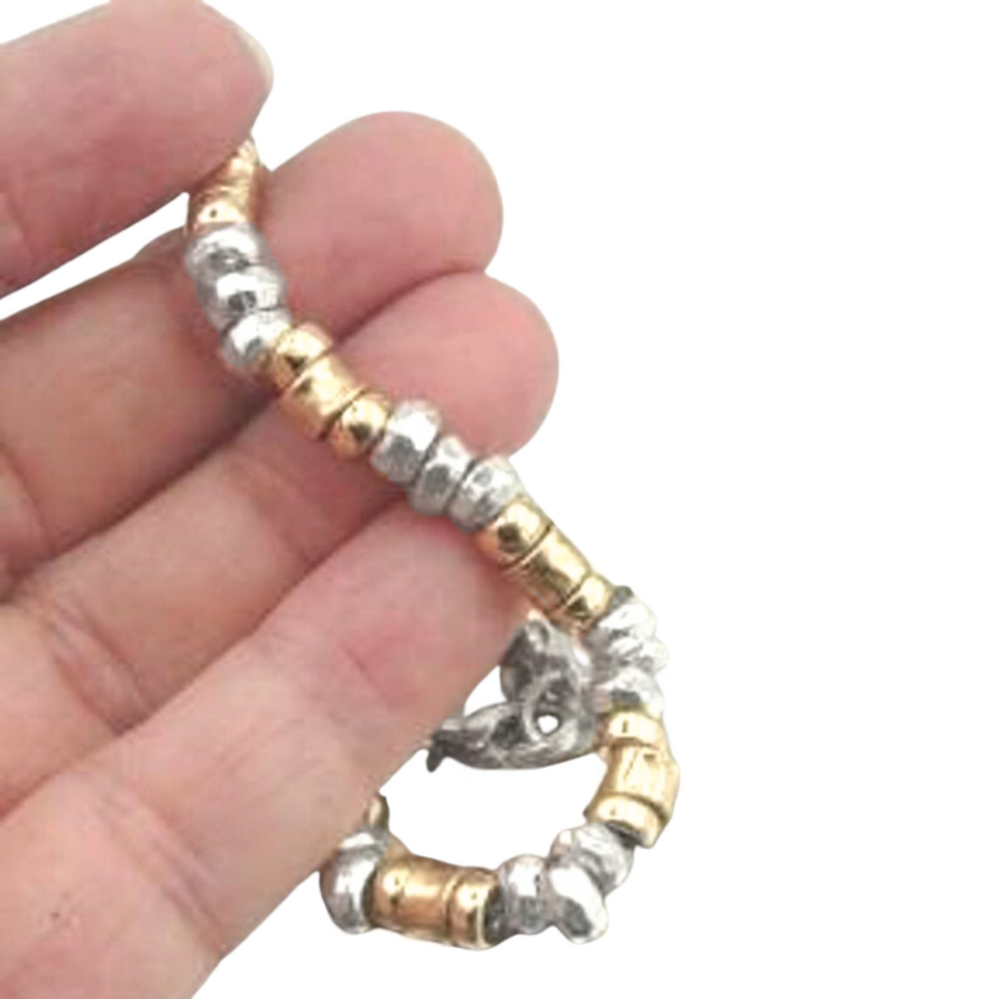 The Bracelet is made of solid Sterling silver and a Yellow gold-filled, 14K. Highlighting the sparkling Solid metal beads.
