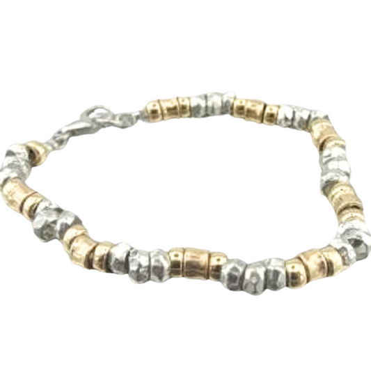 The Bracelet is made of solid Sterling silver and a Yellow gold-filled, 14K. Highlighting the sparkling Solid metal beads.