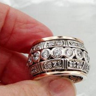 Sterling silver ring with 9k rose gold decorated with sparkling zircons.