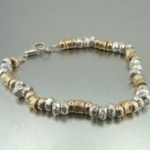 Hadar jewelry Handmade 14k Gold Filled Sterling Silver Bracelet The Bracelet is made of solid Sterling silver and a Yellow gold-filled, 14K. Highlighting the sparkling Solid metal beads.