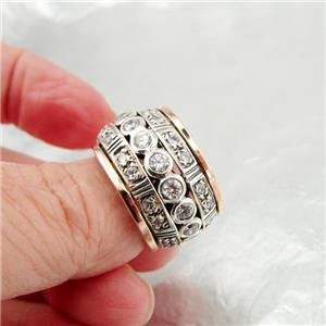 Sterling silver ring with 9k rose gold decorated with sparkling zircons.
