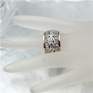 Sterling silver ring with 9k rose gold decorated with sparkling zircons.