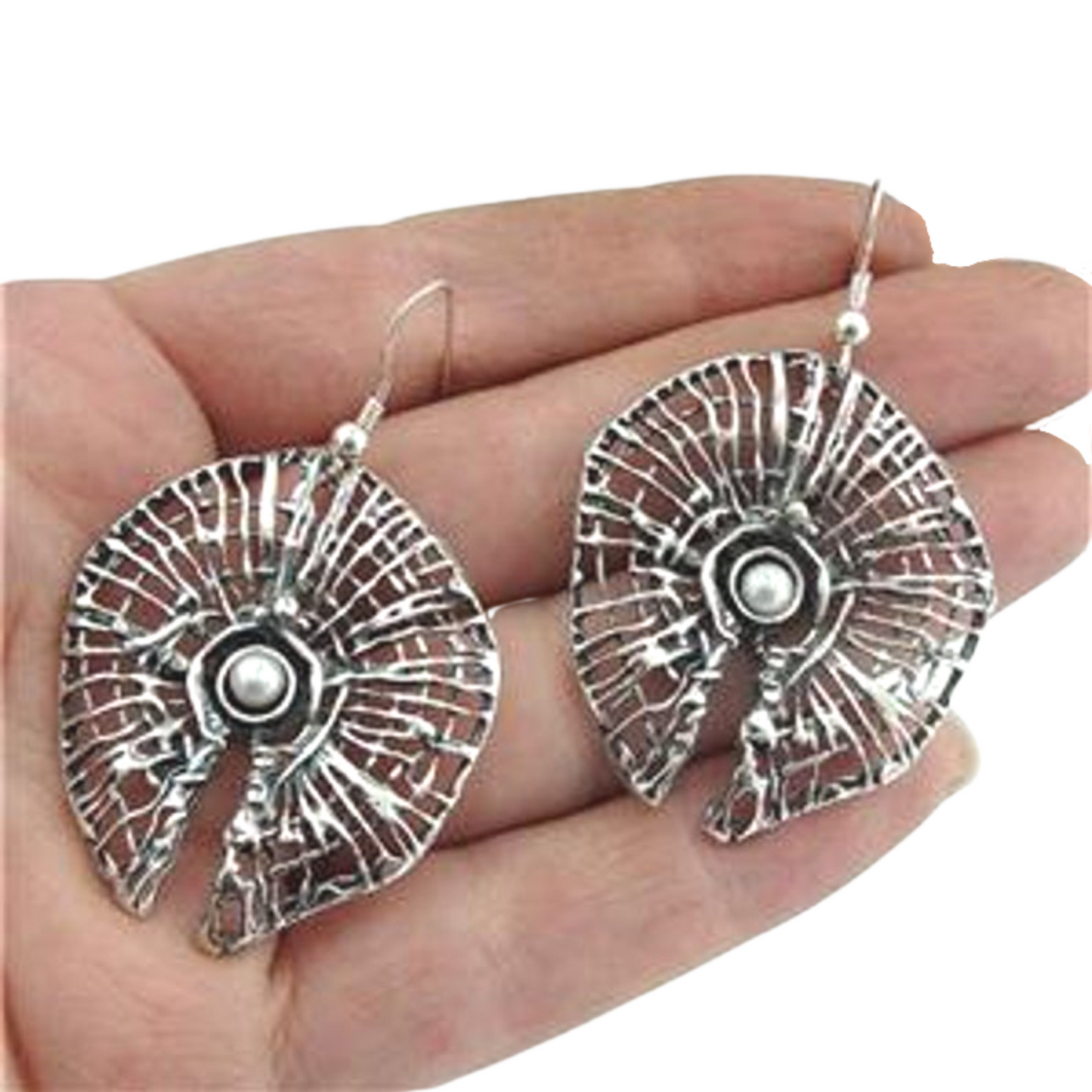 sculptural sterling silver net with a round freshwater Pearl.