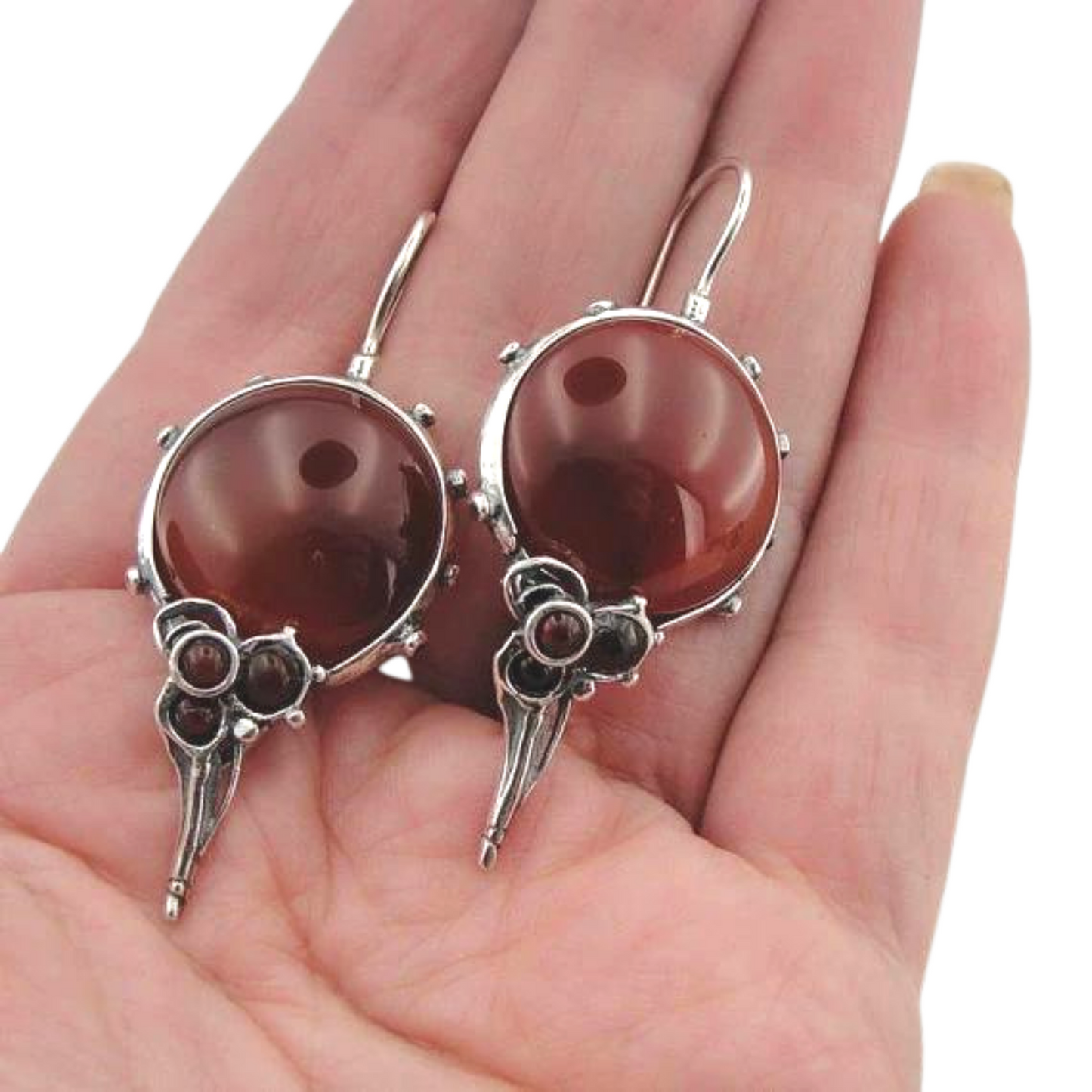 Round natural Carnelian gemstones set in a sterling silver frame.