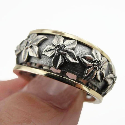 Swivel band ring decorated with flower shapes, red zircon and 9K gold ring