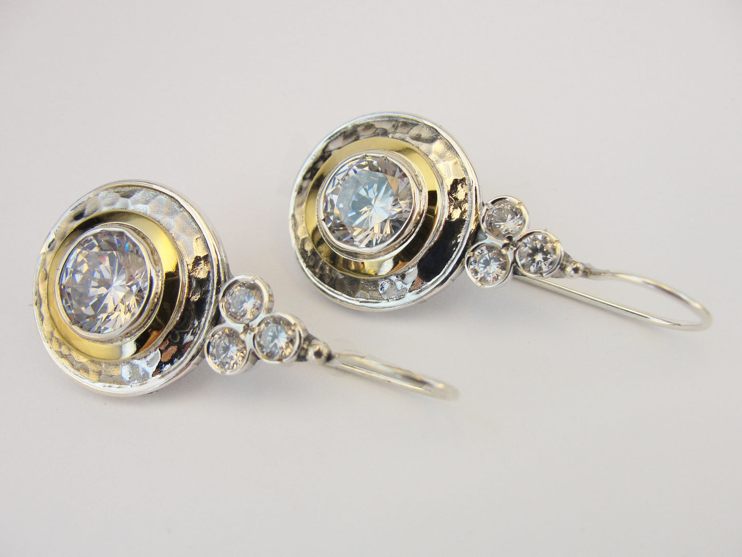 9k yellow gold and sterling silver earrings with sparkling white zircons.