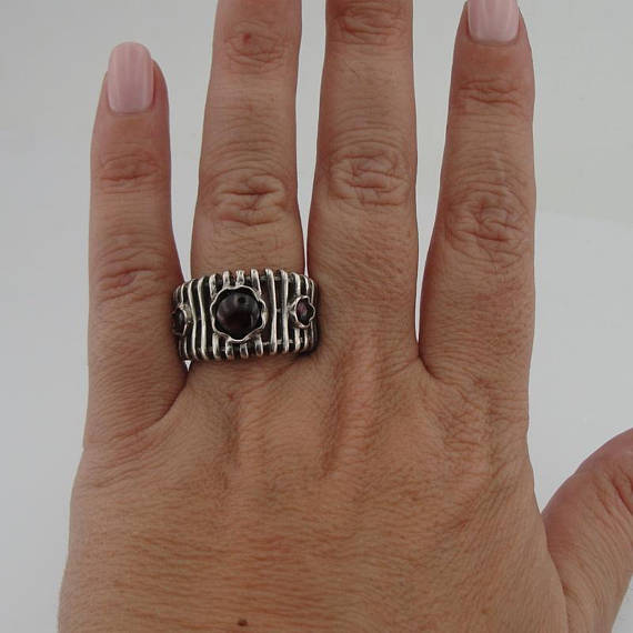 Wide lines' texture sterling silver ring with three round Natural Garnet gemstones.