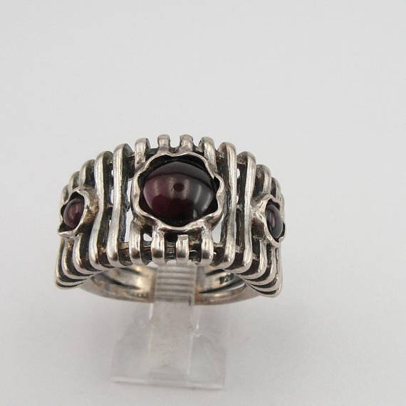 Wide lines' texture sterling silver ring with three round Natural Garnet gemstones.