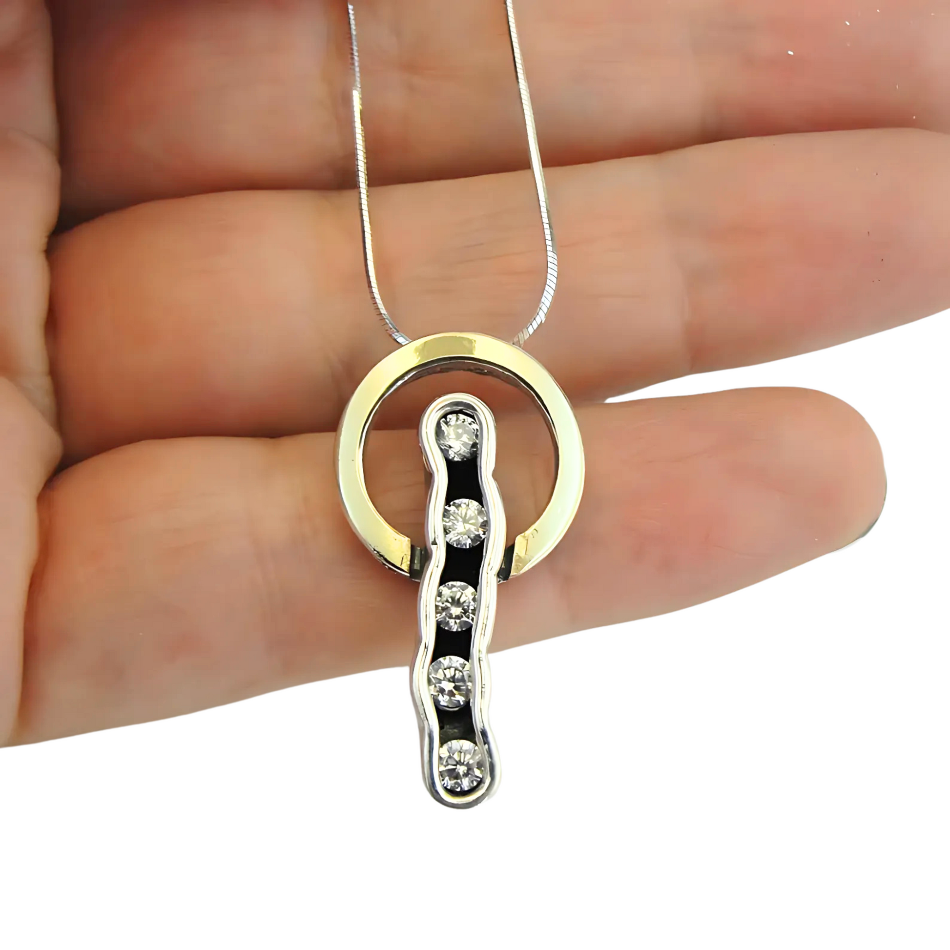 Sterling silver and 9K yellow gold pendant with clear zircon stones, perfect for adding elegance and sophistication to any outfit. A meaningful Christmas gift.