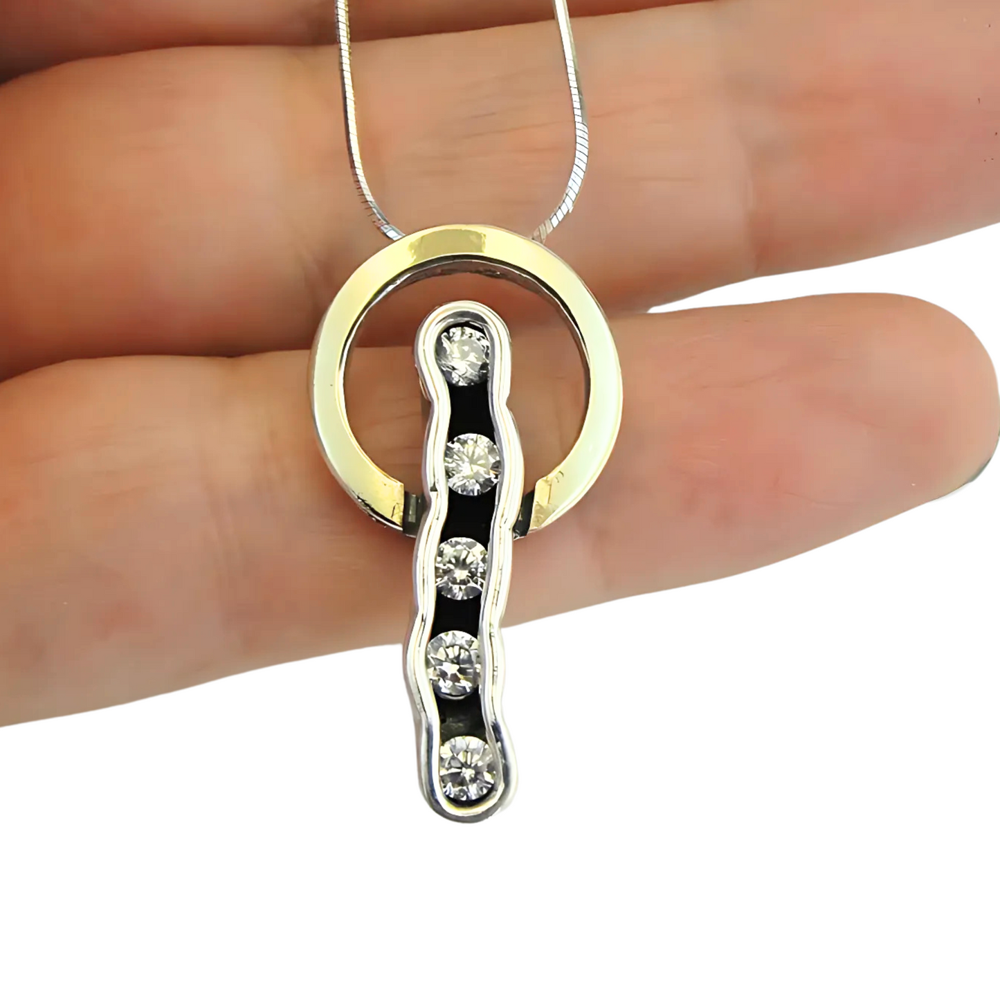 Sterling silver and 9K yellow gold pendant with clear zircon stones, perfect for adding elegance and sophistication to any outfit. A meaningful Christmas gift.