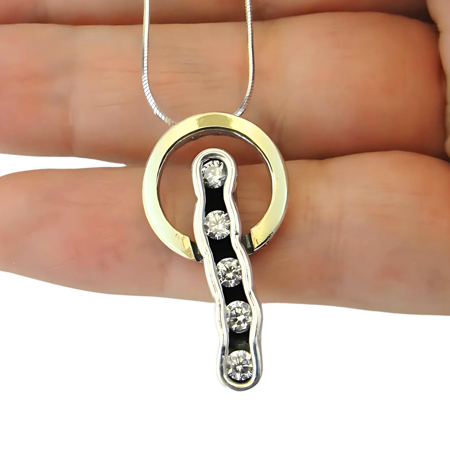 Sterling silver and 9K yellow gold pendant with clear zircon stones, perfect for adding elegance and sophistication to any outfit. A meaningful Christmas gift.