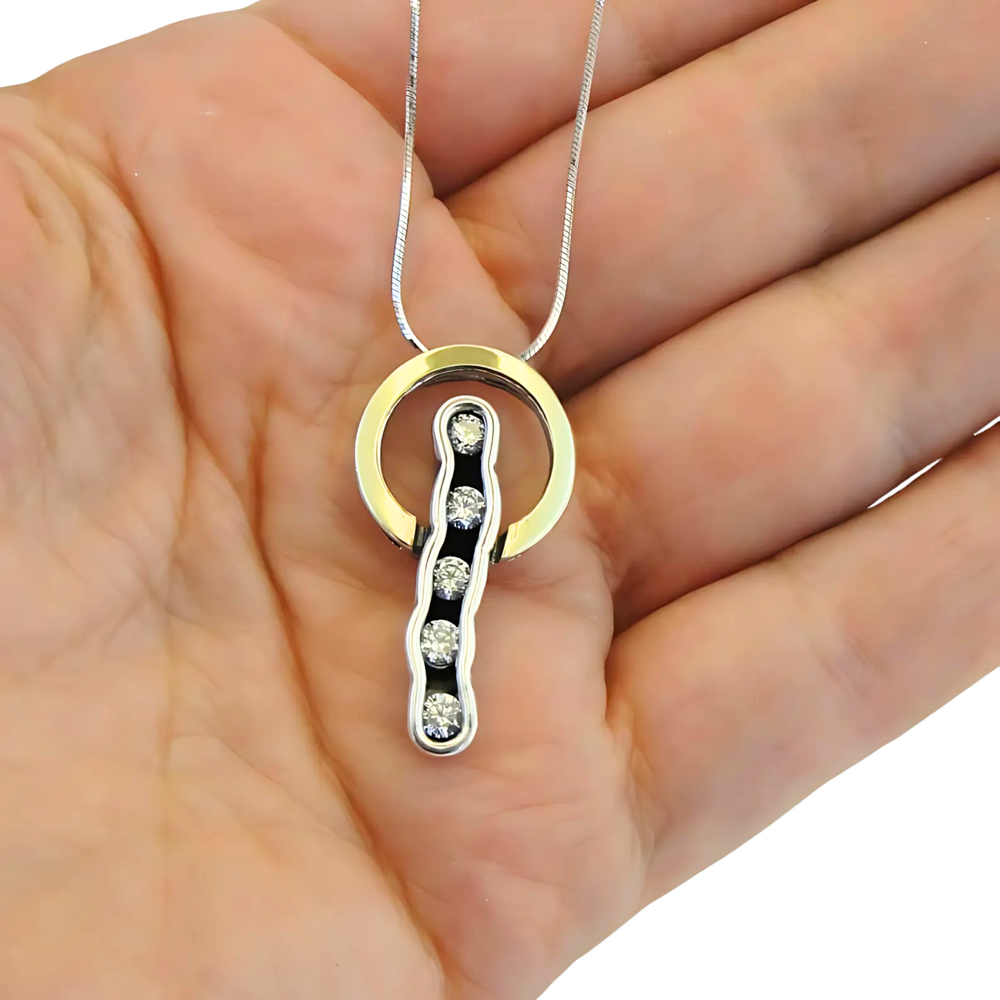 Sterling silver and 9K yellow gold pendant with clear zircon stones, perfect for adding elegance and sophistication to any outfit. A meaningful Christmas gift.