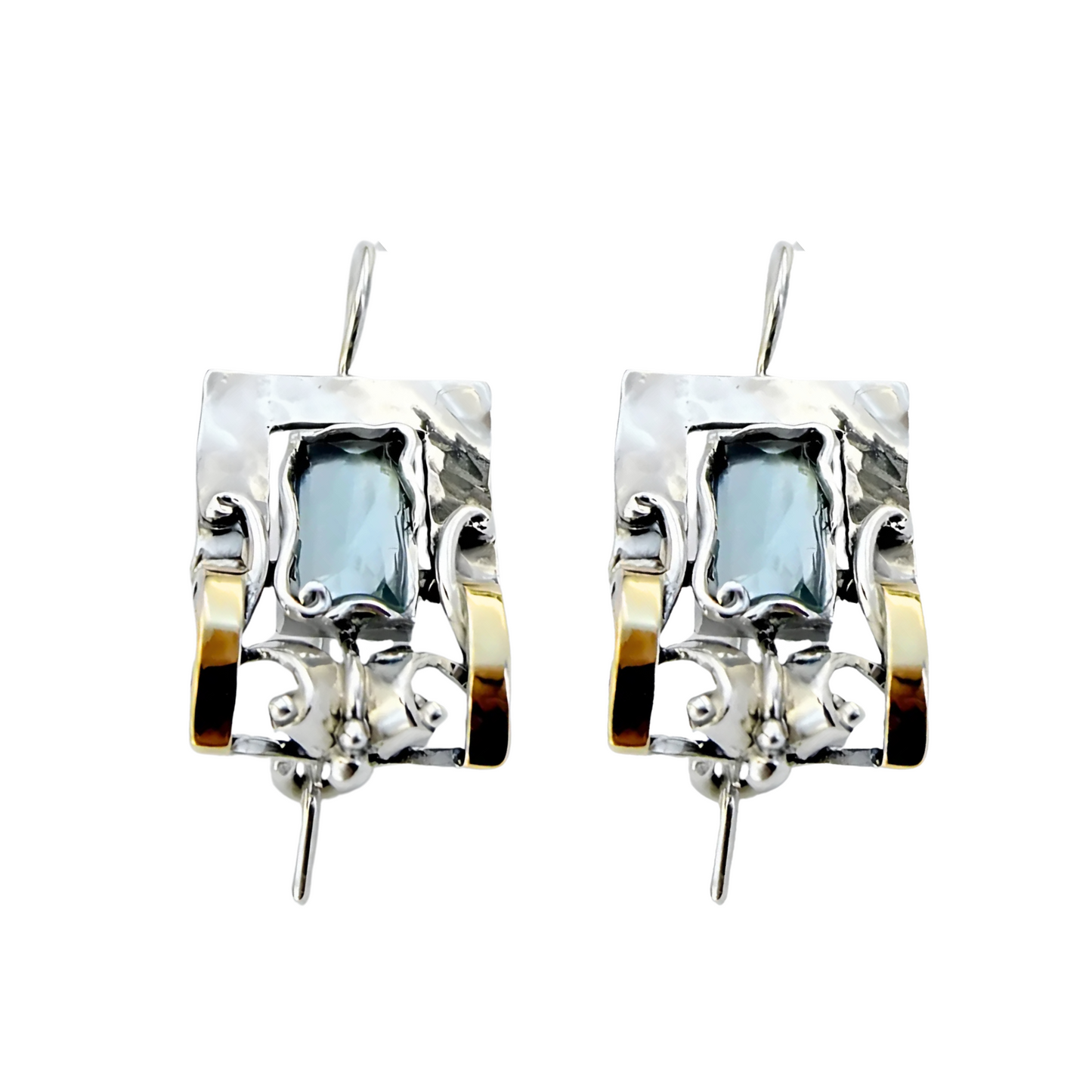 Handcrafted sterling silver earrings featuring a rectangular blue topaz gemstone with elegant yellow gold accents and intricate detailing, designed by Hadar Jewelry. These artisan earrings blend contemporary style with timeless sophistication, perfect for a unique statement look.