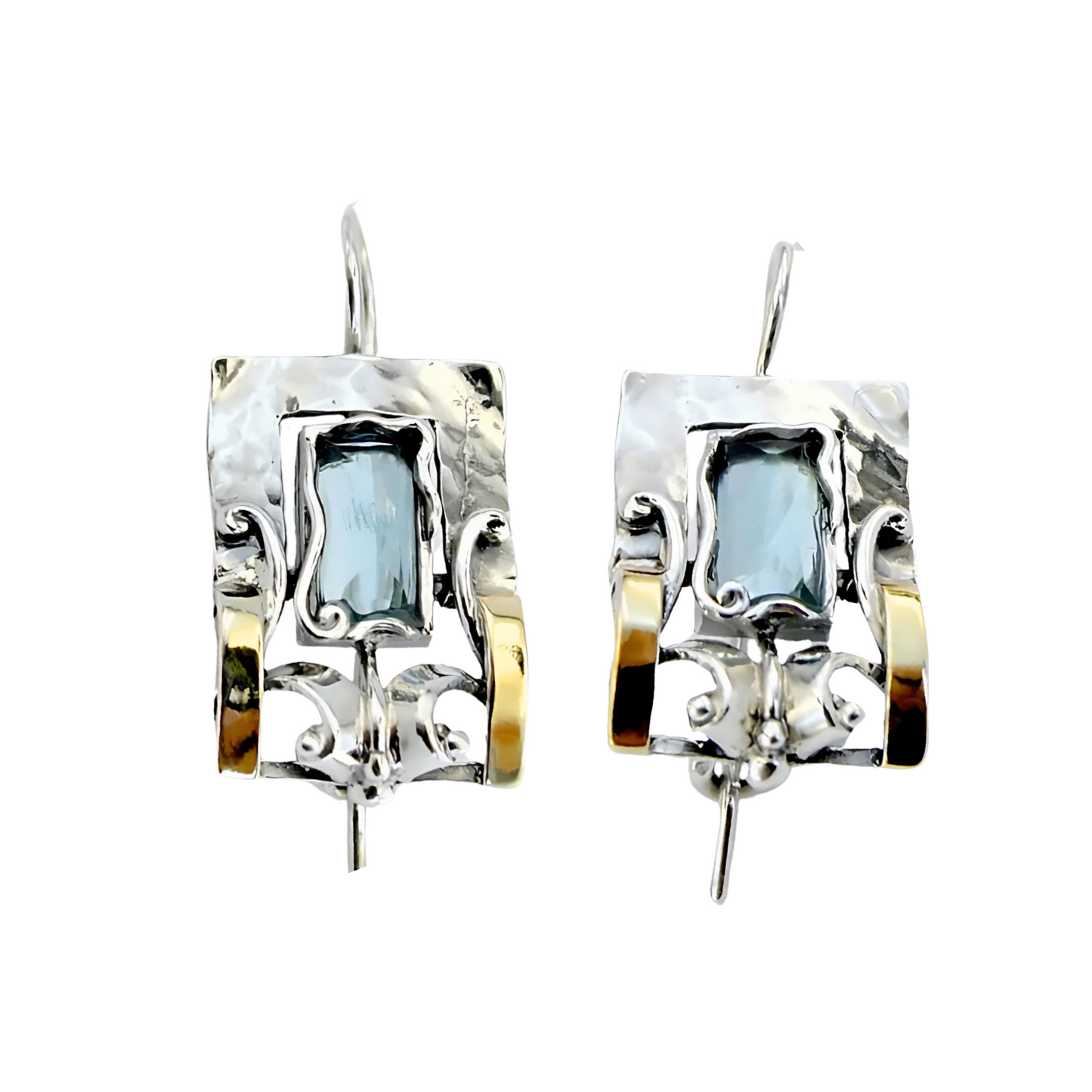 Handcrafted sterling silver earrings featuring a rectangular blue topaz gemstone with elegant yellow gold accents and intricate detailing, designed by Hadar Jewelry. These artisan earrings blend contemporary style with timeless sophistication, perfect for a unique statement look.