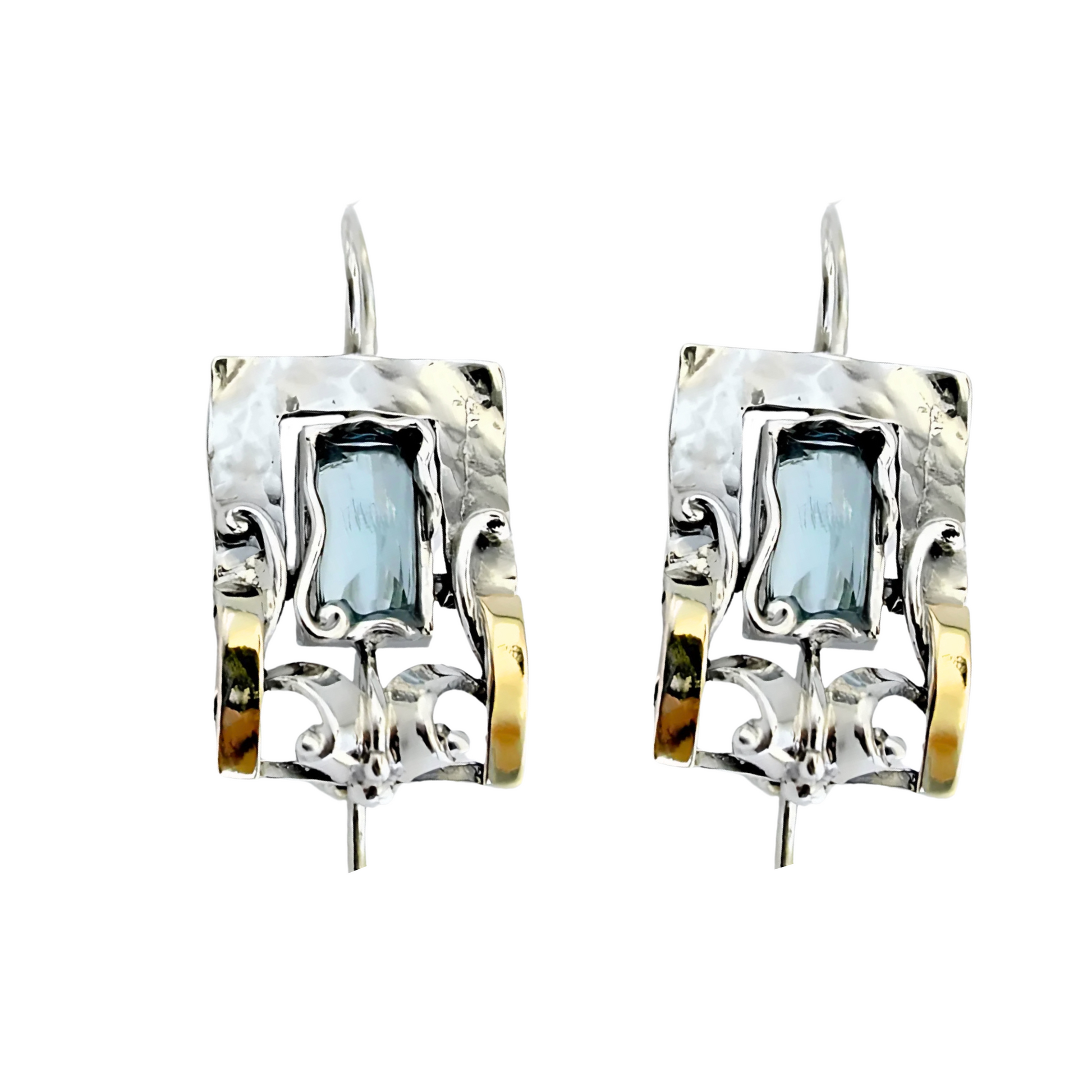 Handcrafted sterling silver earrings featuring a rectangular blue topaz gemstone with elegant yellow gold accents and intricate detailing, designed by Hadar Jewelry. These artisan earrings blend contemporary style with timeless sophistication, perfect for a unique statement look.