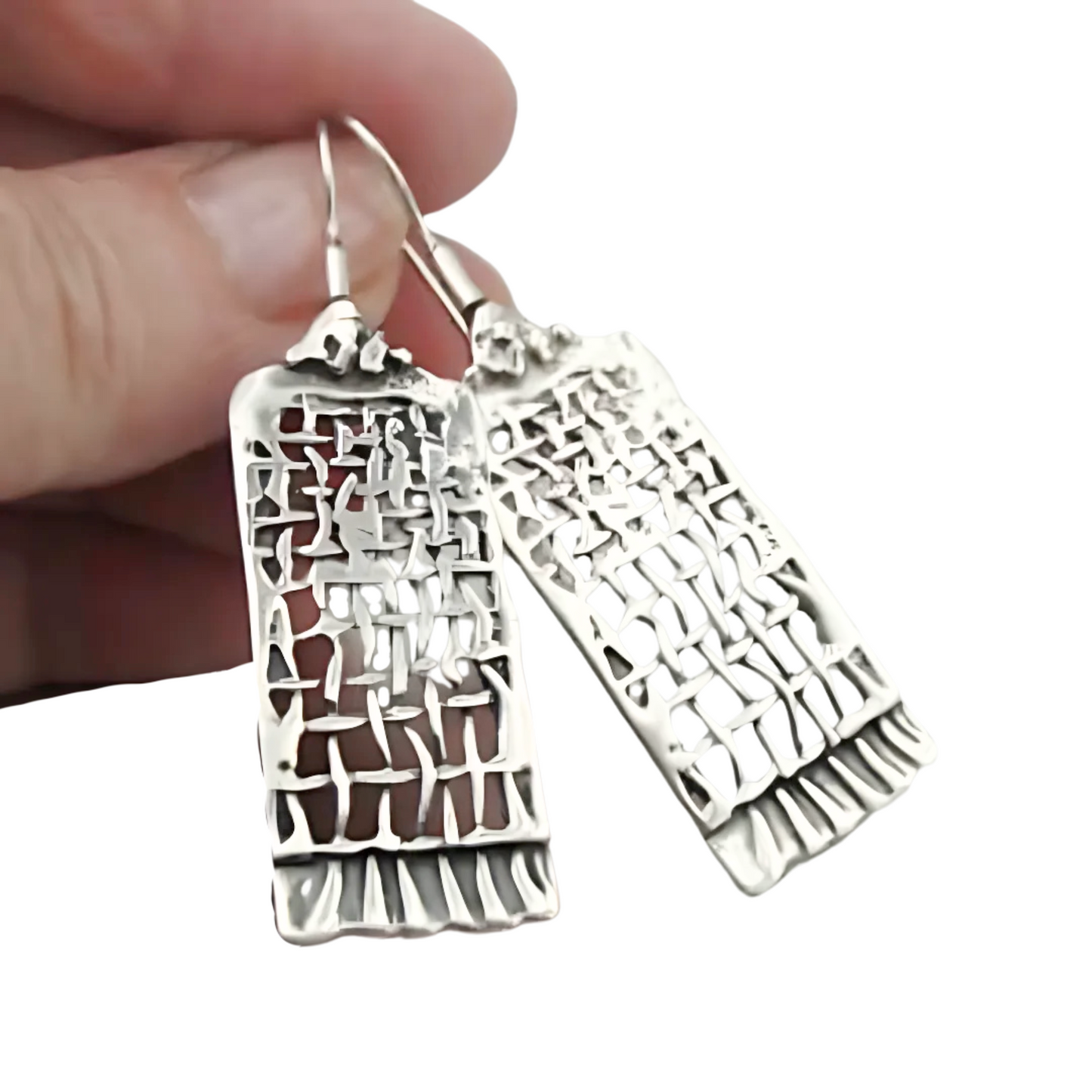 Handmade sterling silver earrings from the "Nets" collection, featuring a unique, contemporary design with intricate detailing. Perfect for a meaningful Christmas gift, combining elegance and craftsmanship. A luxurious accessory for those who appreciate fine jewelry and timeless style.