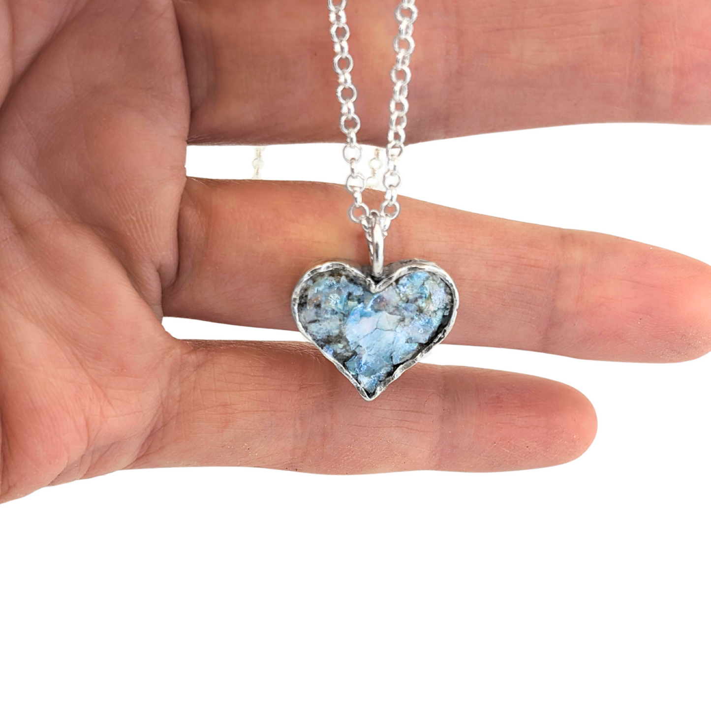 Authentic Roman Glass Heart Pendant in Sterling Silver, featuring a textured silver setting with a heart-shaped inlay of genuine Roman glass. Timeless, handcrafted jewelry, ready to ship for Christmas
