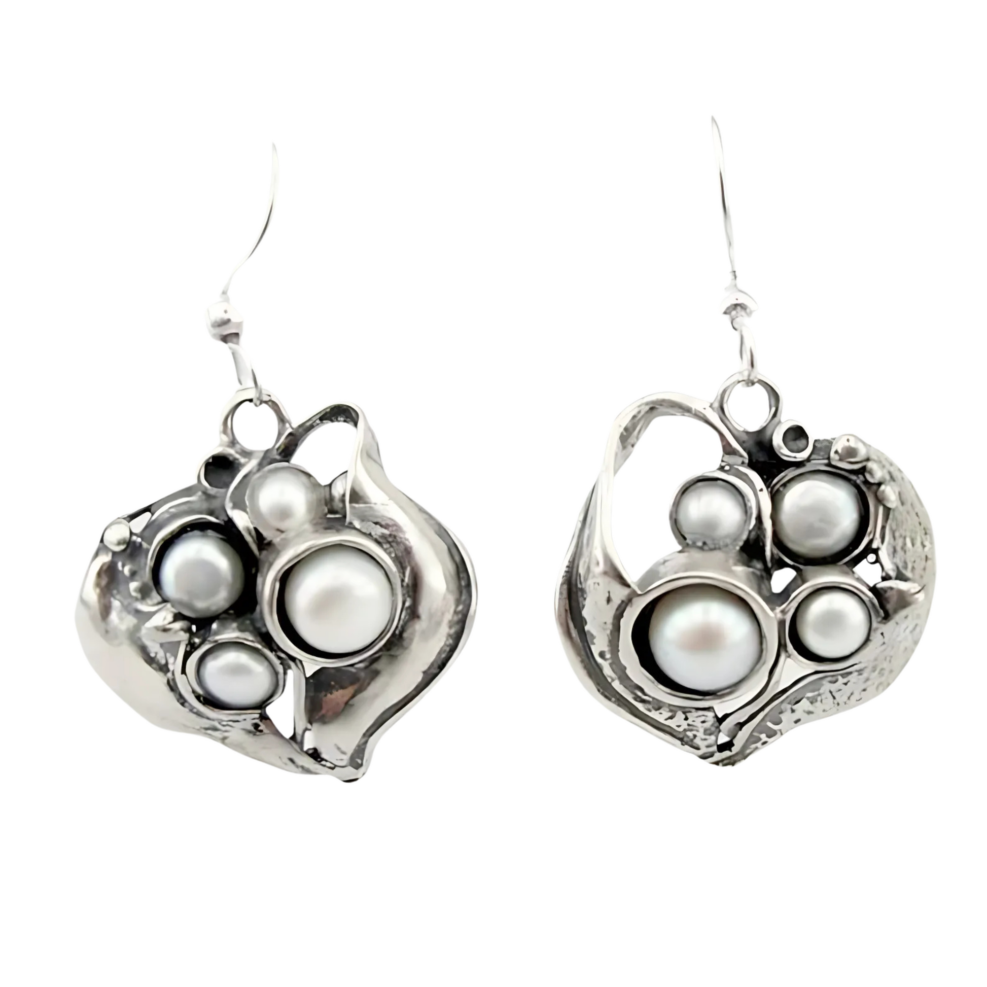 Sculpted sterling silver earrings with an organic design, featuring multiple freshwater pearls in a unique, artistic arrangement. These handmade earrings bring an elegant and natural-inspired look, perfect for statement jewelry lovers.