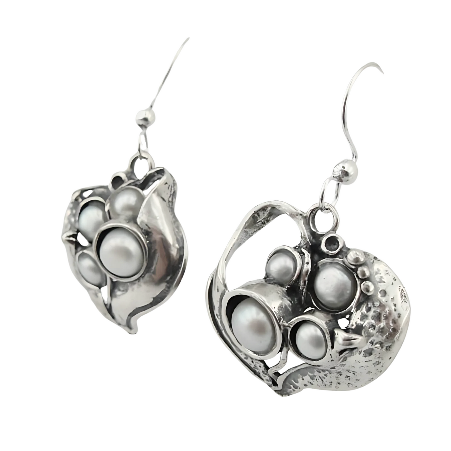 Sculpted sterling silver earrings with an organic design, featuring multiple freshwater pearls in a unique, artistic arrangement. These handmade earrings bring an elegant and natural-inspired look, perfect for statement jewelry lovers.