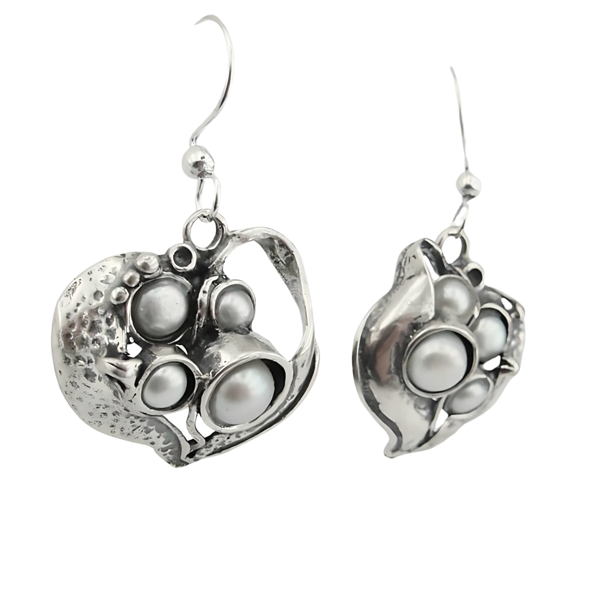 Sculpted sterling silver earrings with an organic design, featuring multiple freshwater pearls in a unique, artistic arrangement. These handmade earrings bring an elegant and natural-inspired look, perfect for statement jewelry lovers.