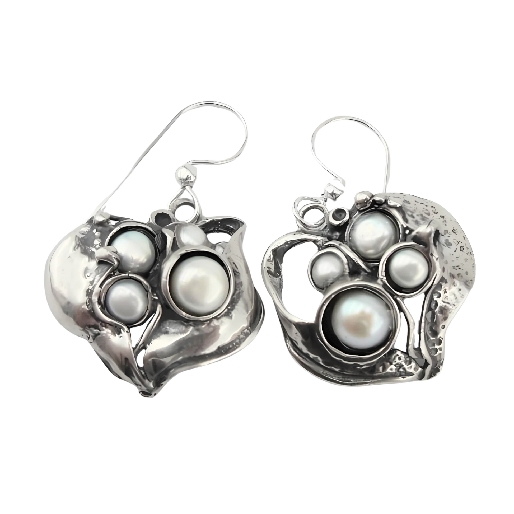 Sculpted sterling silver earrings with an organic design, featuring multiple freshwater pearls in a unique, artistic arrangement. These handmade earrings bring an elegant and natural-inspired look, perfect for statement jewelry lovers.