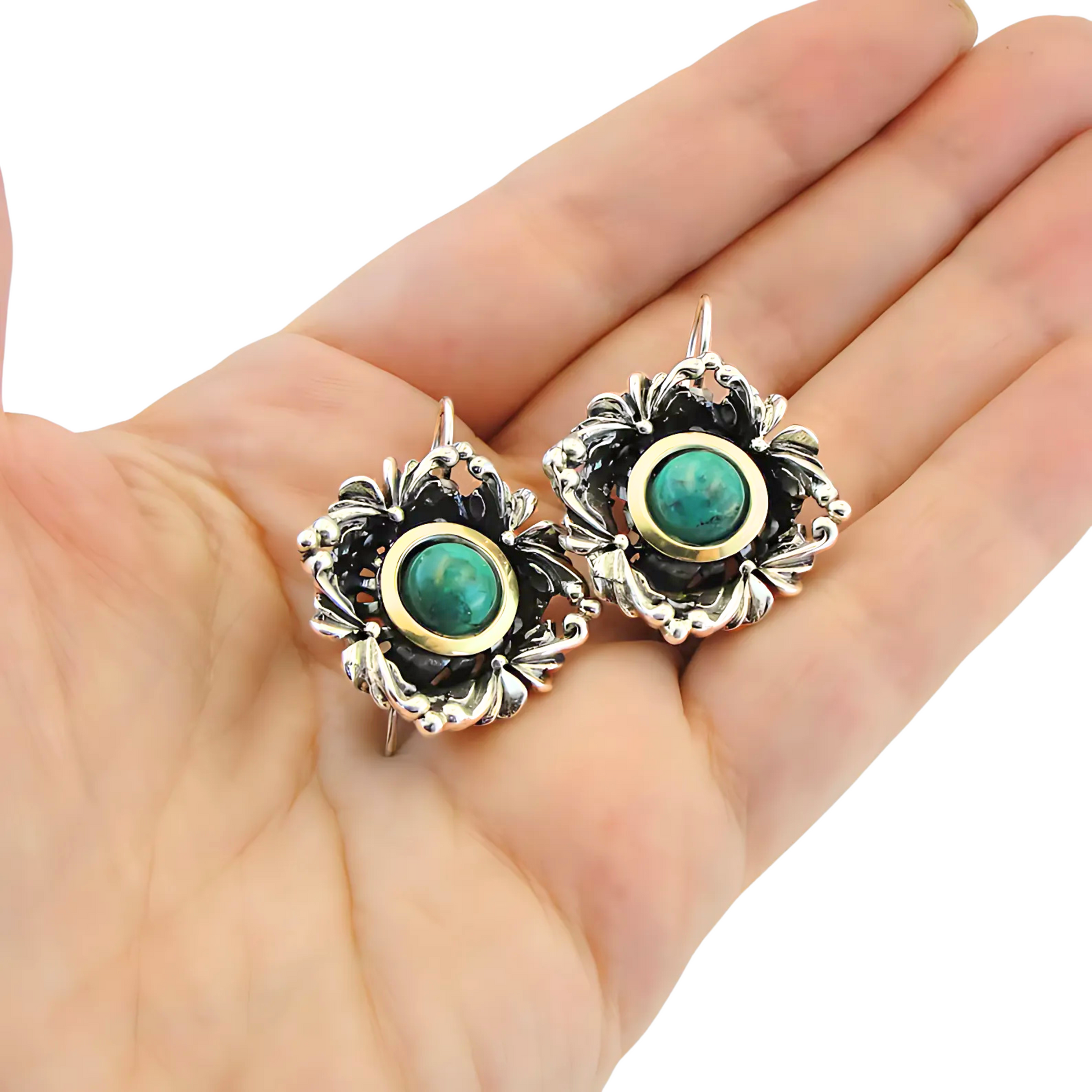 Handcrafted sterling silver earrings with intricate floral design, featuring vibrant turquoise stones and yellow gold accents. These unique earrings by Hadar Jewelry are perfect for adding a touch of elegance and color to any outfit.