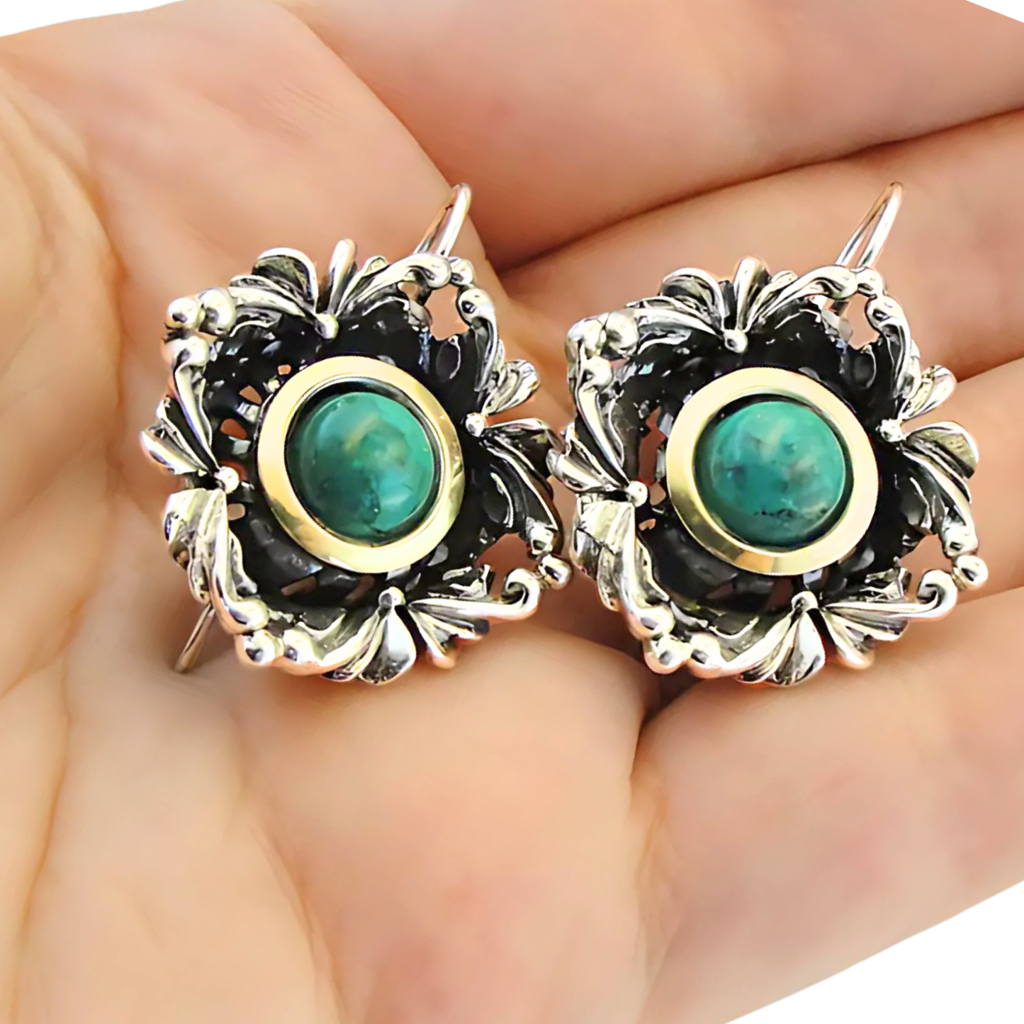 Handcrafted sterling silver earrings with intricate floral design, featuring vibrant turquoise stones and yellow gold accents. These unique earrings by Hadar Jewelry are perfect for adding a touch of elegance and color to any outfit.