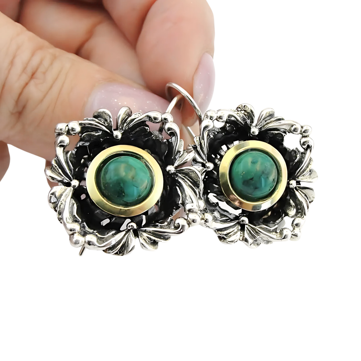 Handcrafted sterling silver earrings with intricate floral design, featuring vibrant turquoise stones and yellow gold accents. These unique earrings by Hadar Jewelry are perfect for adding a touch of elegance and color to any outfit.