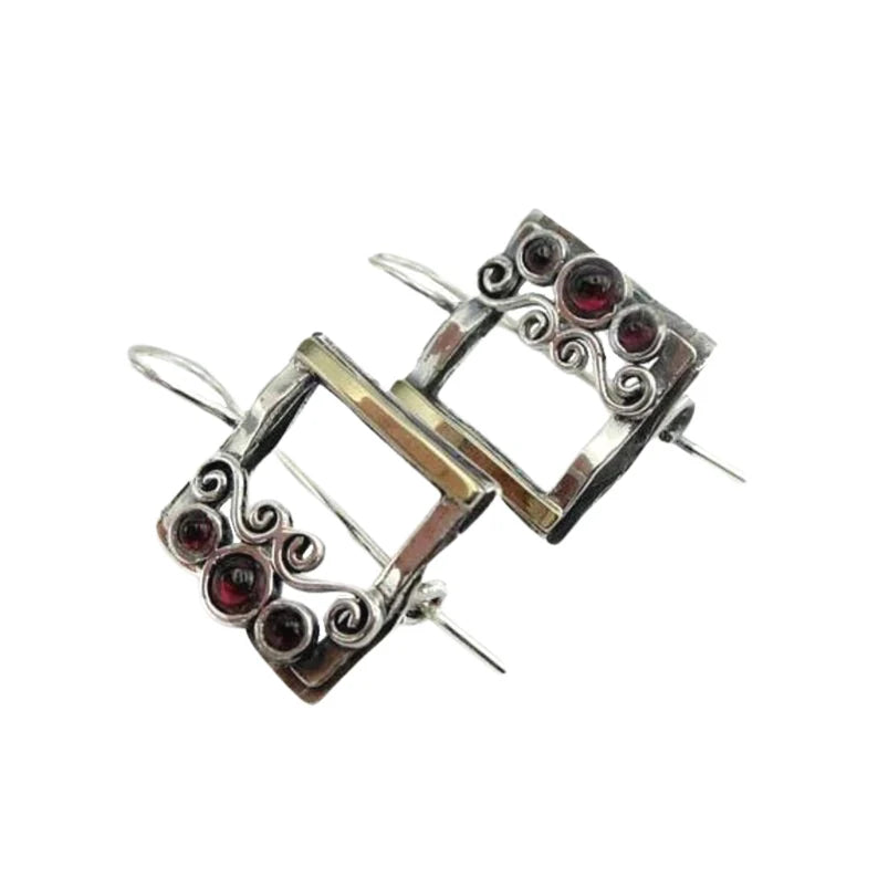 sterling silver square earrings with three rich red garnet gemstones, offering a sophisticated and unique design. Perfect for adding elegance and a pop of color to any outfit, making it a luxurious statement piece. A meaningful and timeless gift, ideal for special occasions and celebrations