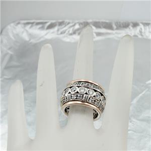 Sterling silver ring with 9k rose gold decorated with sparkling zircons.