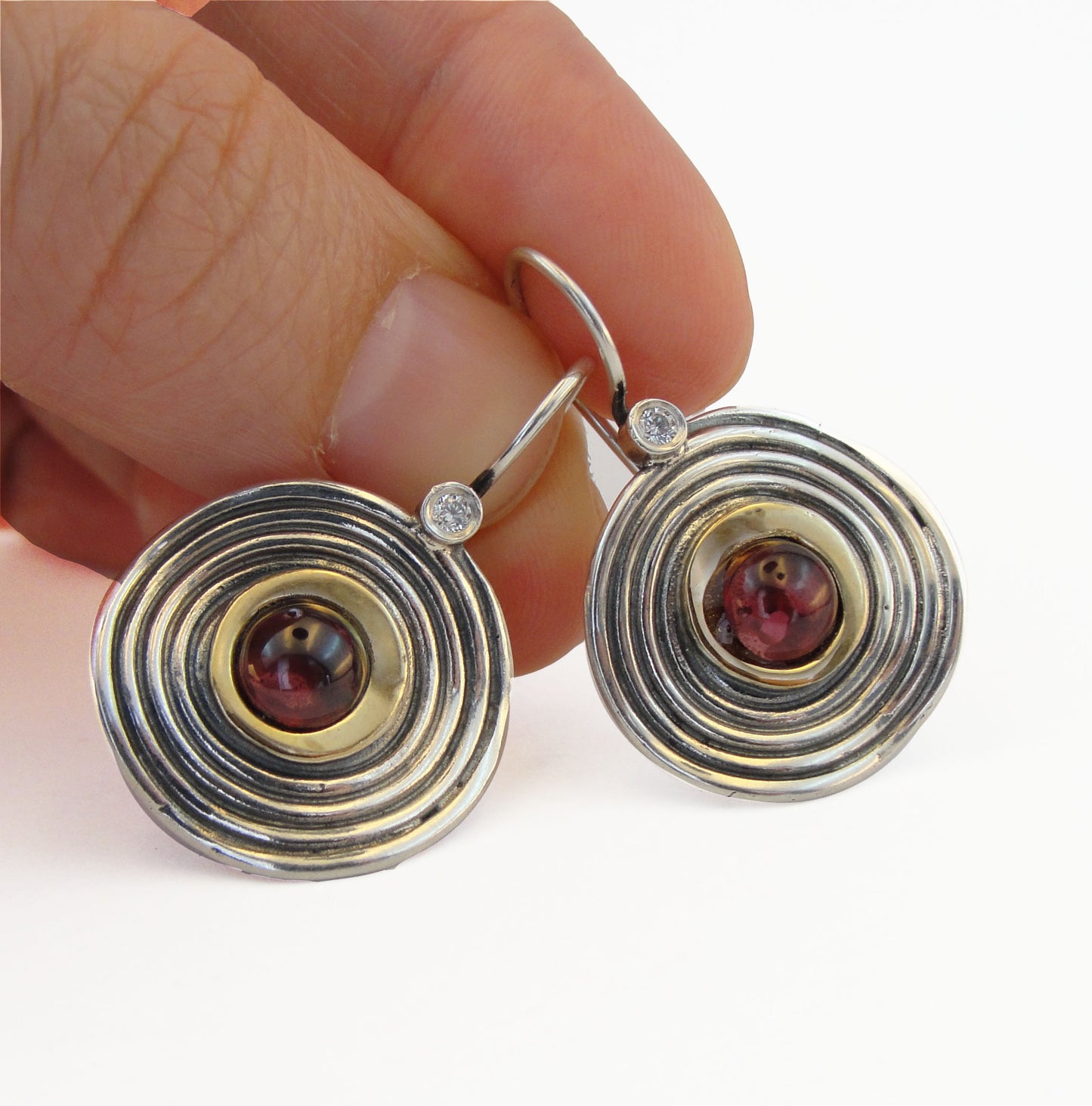 Round shape sterling silver dangle earrings with gold and natural red garnet and a dot of white Zircon