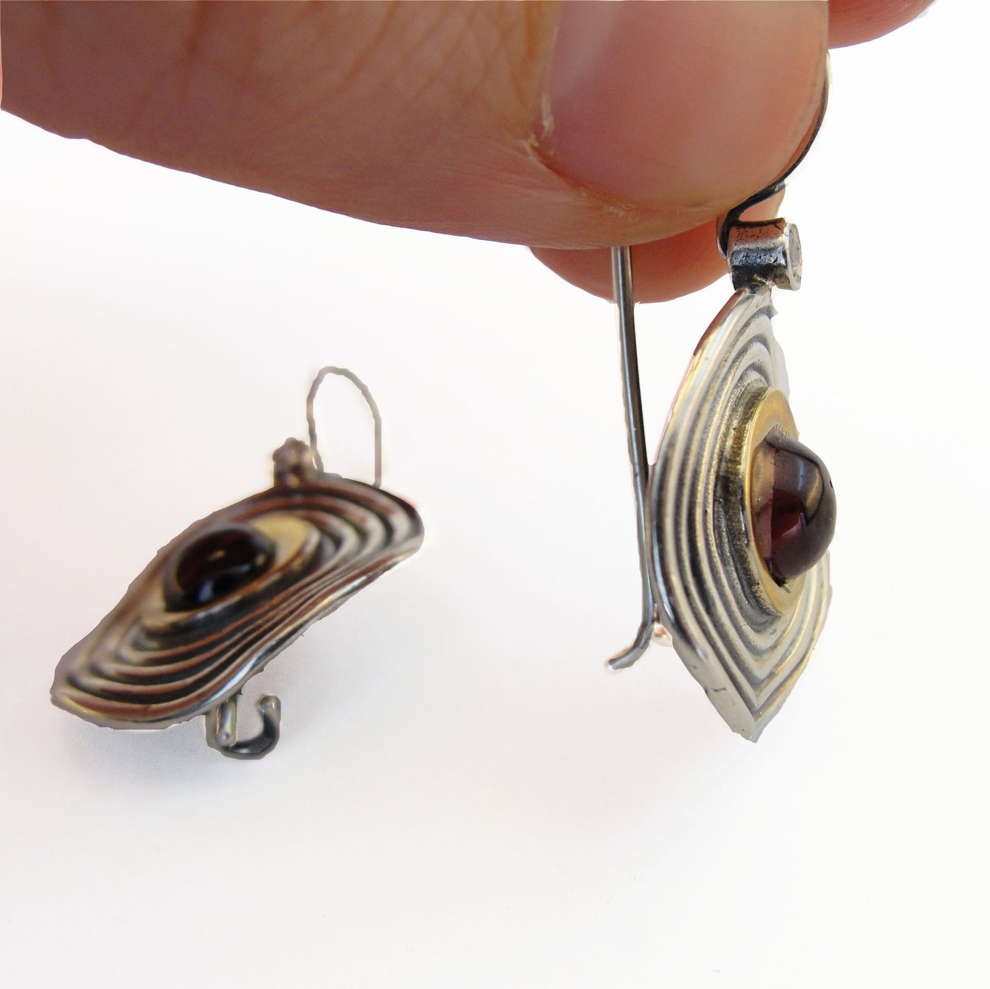 Round shape sterling silver dangle earrings with gold and natural red garnet and a dot of white Zircon