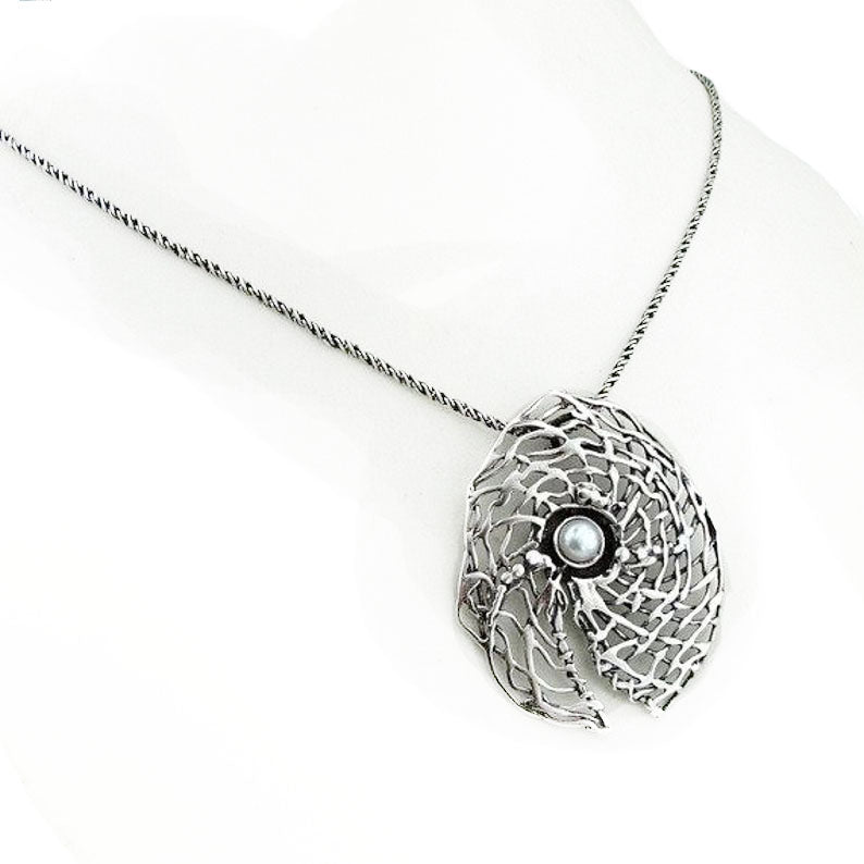 Round sterling silver net pendant with white natural gemstone.