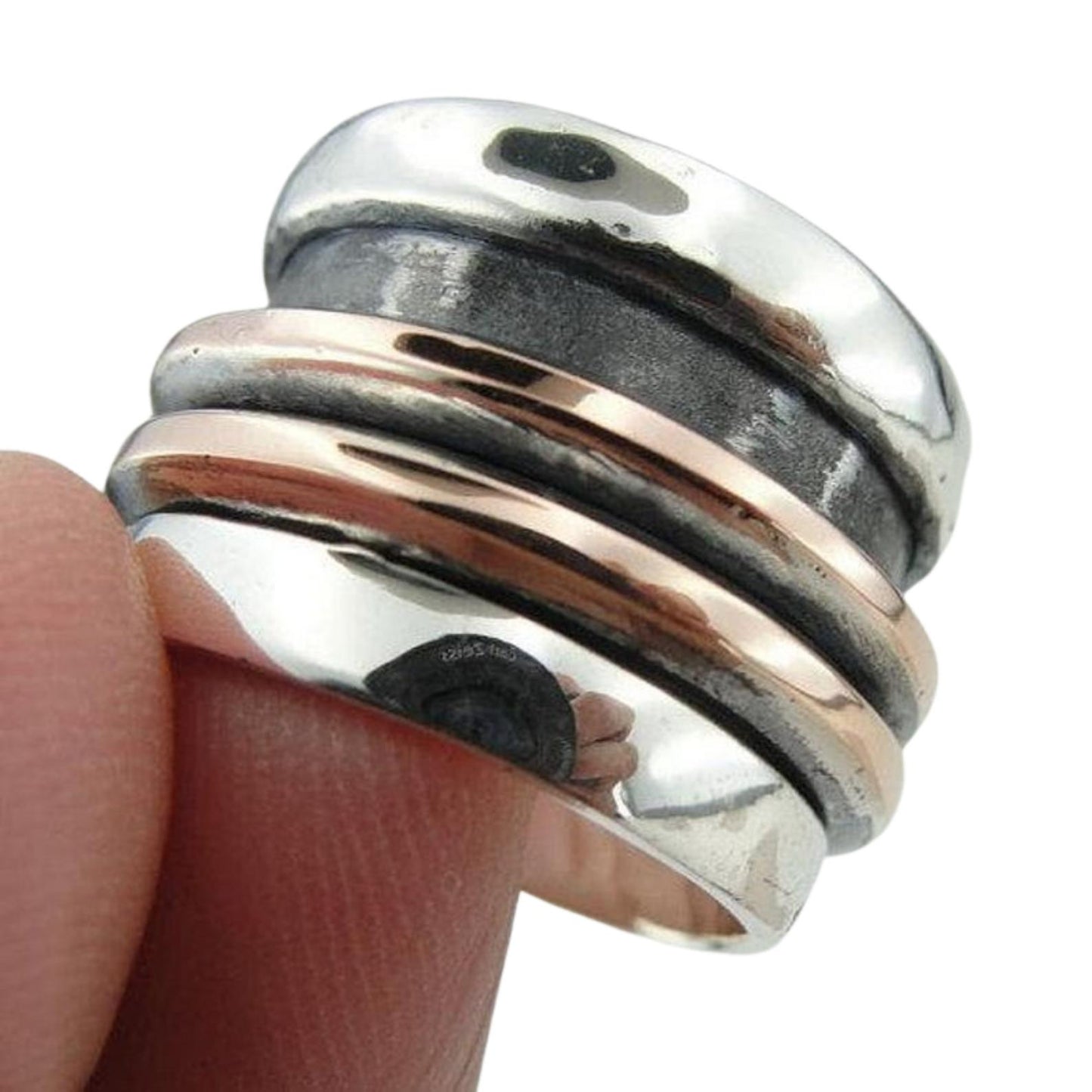 Wide and Swivelling Sterling silver ring, decorated with red gold swivel bands