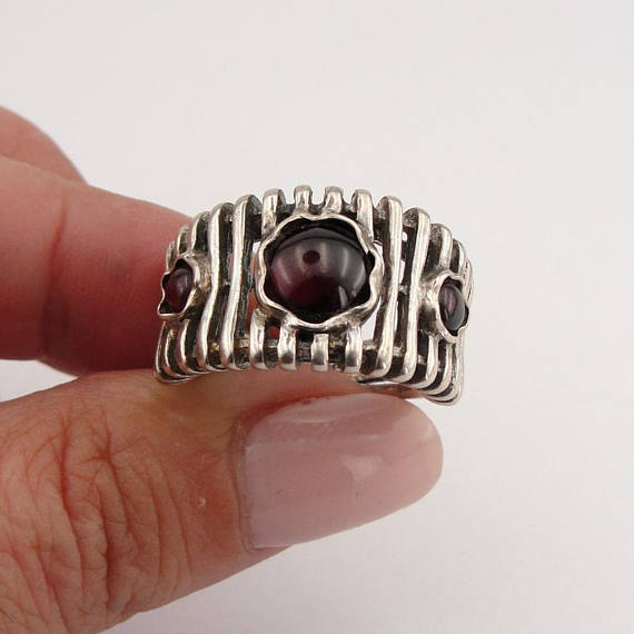 Wide lines' texture sterling silver ring with three round Natural Garnet gemstones.