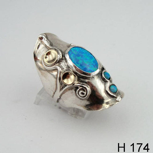 Long blue opal sterling silver ring, decorated with gold