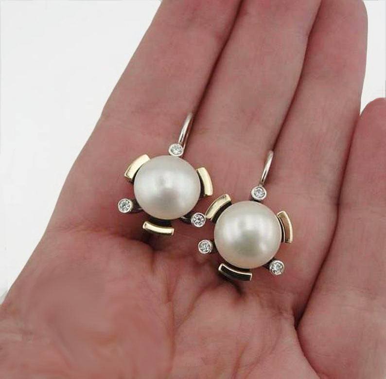 Round 10mm white Pearl inlaid in textured solid Sterling Silver and gold.